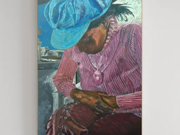 An African woman, in an old kitchen, with her face down -in quiet prayer.