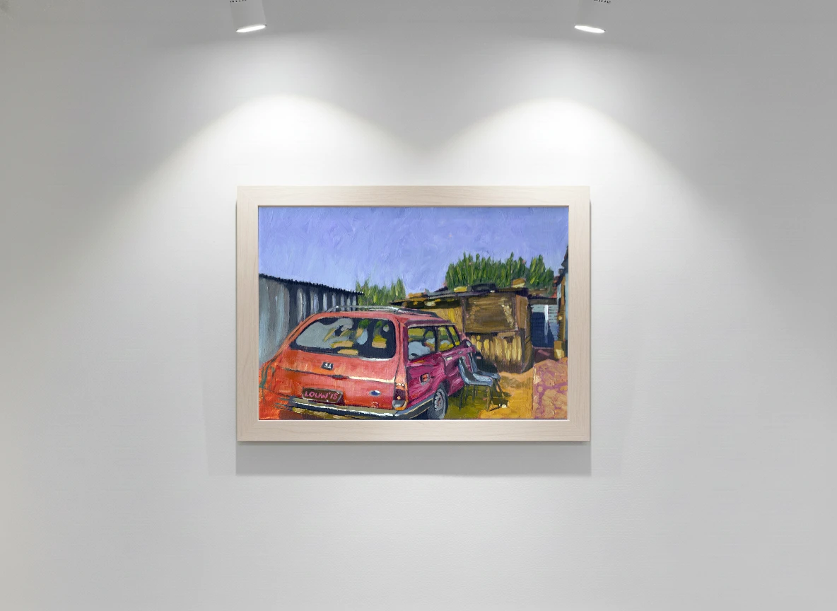 Old red station wagon in dusty front yard.