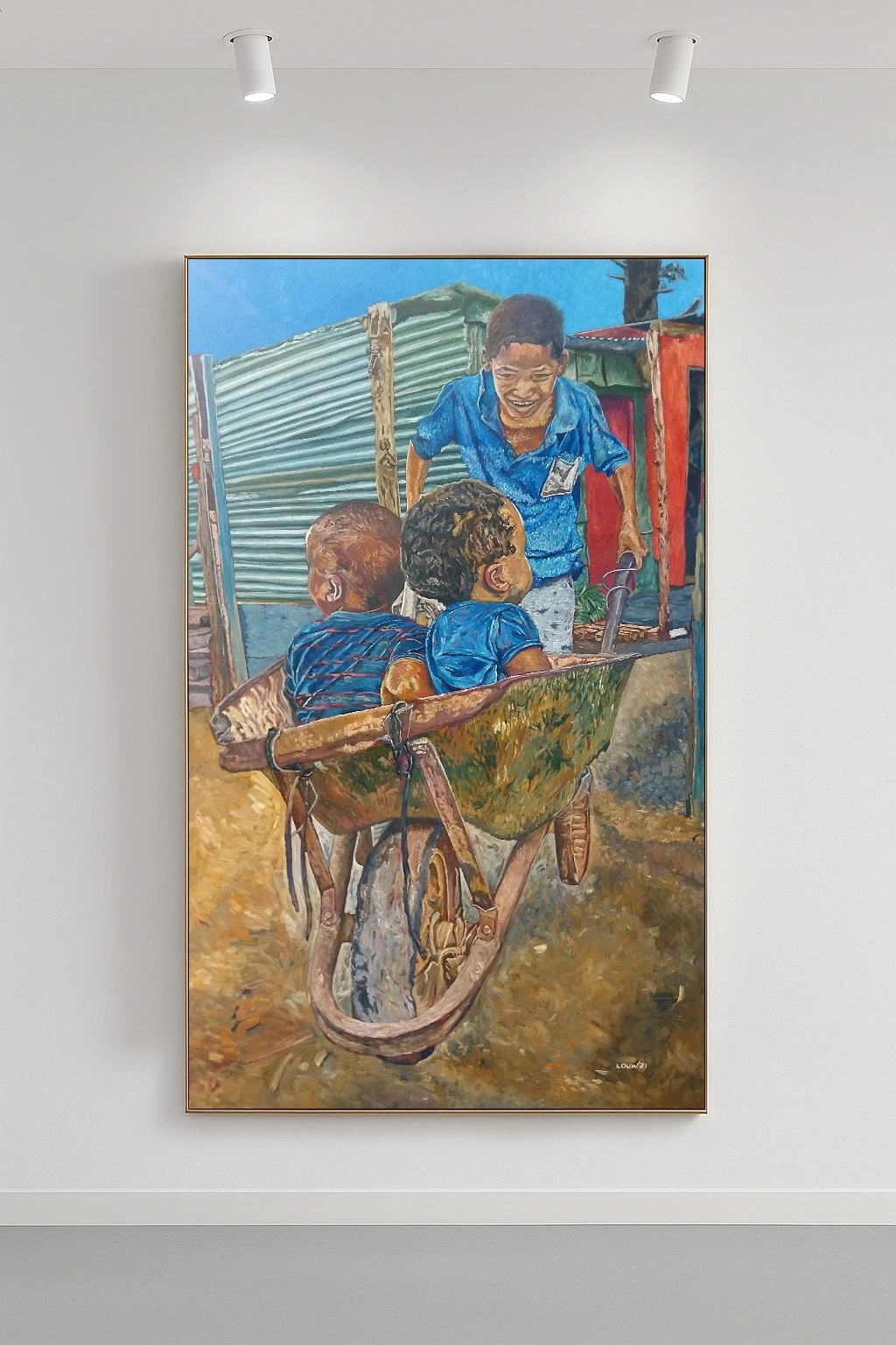 A boy pushing a wheelbarrow that is carrying two toddlers. This is another common and playful sight in a contemporary South Africa.