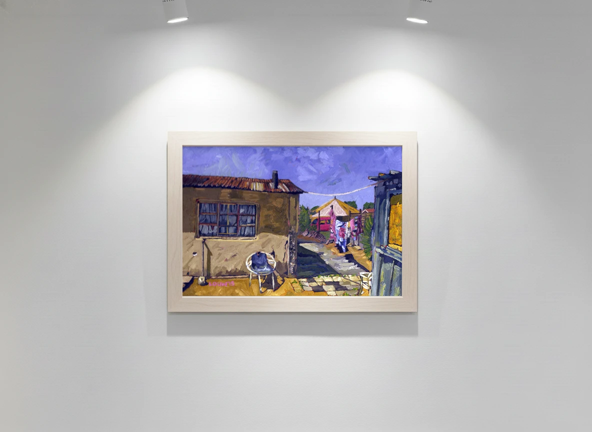 A yellow tent breaking through the mesh of wire fence, green shrubs and clothes drying in the wind; sandwiched between a small house and a iron sheet dwelling.